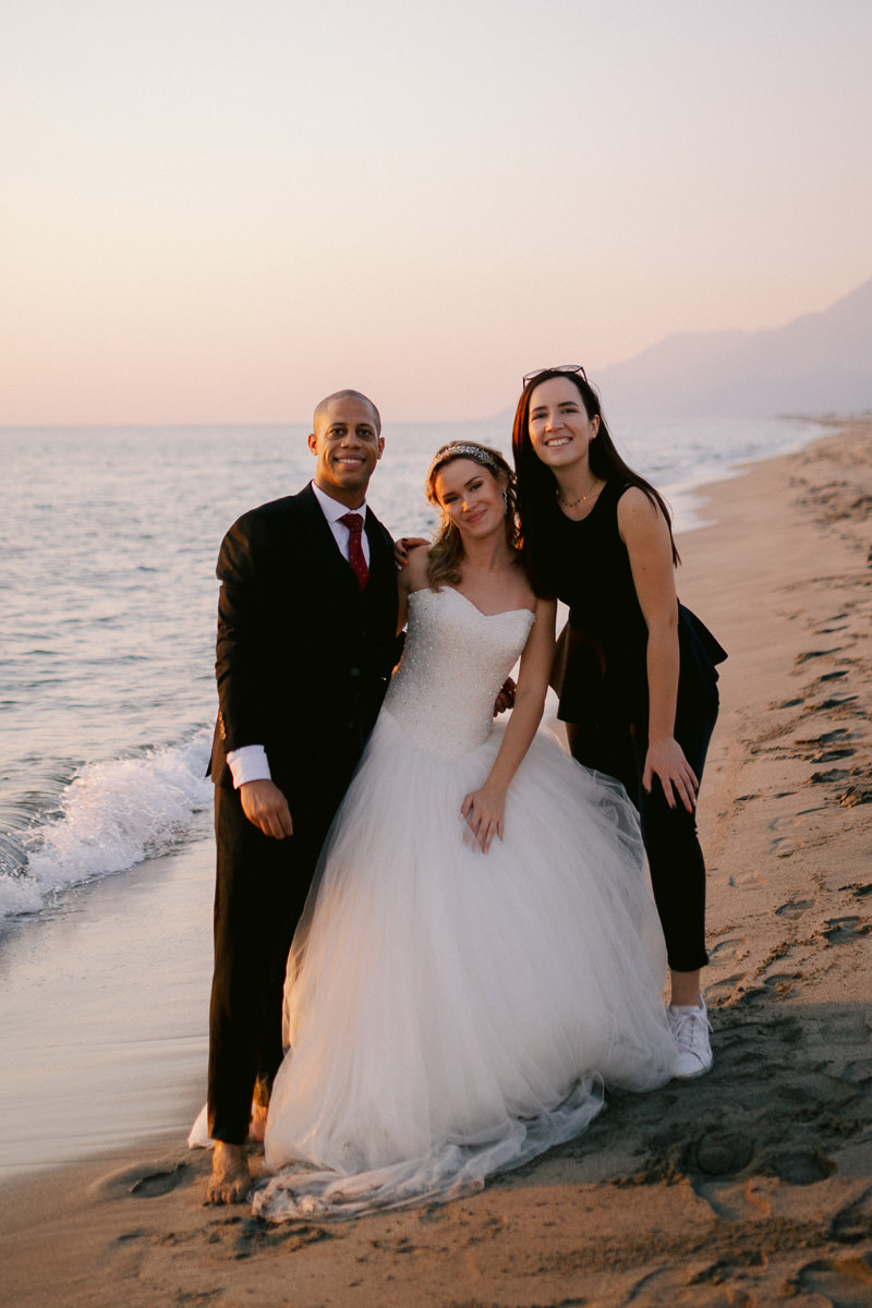 Kristina Hristova the canary islands elopement photographer with a bride and groom on the beach at sunset