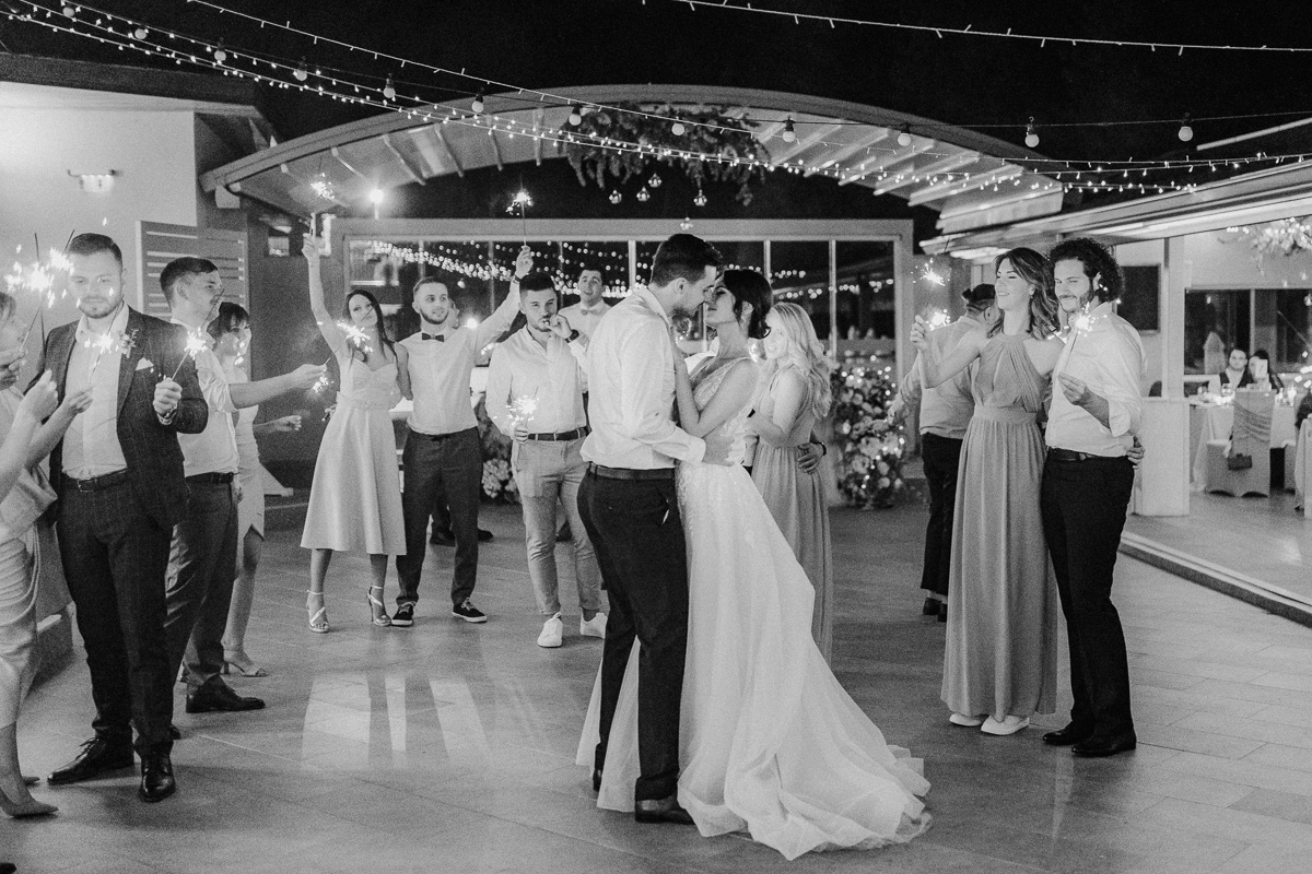First dance of a newly marrried couple in a fancy hotel in the Canary islands with sparkles and string lights in the background